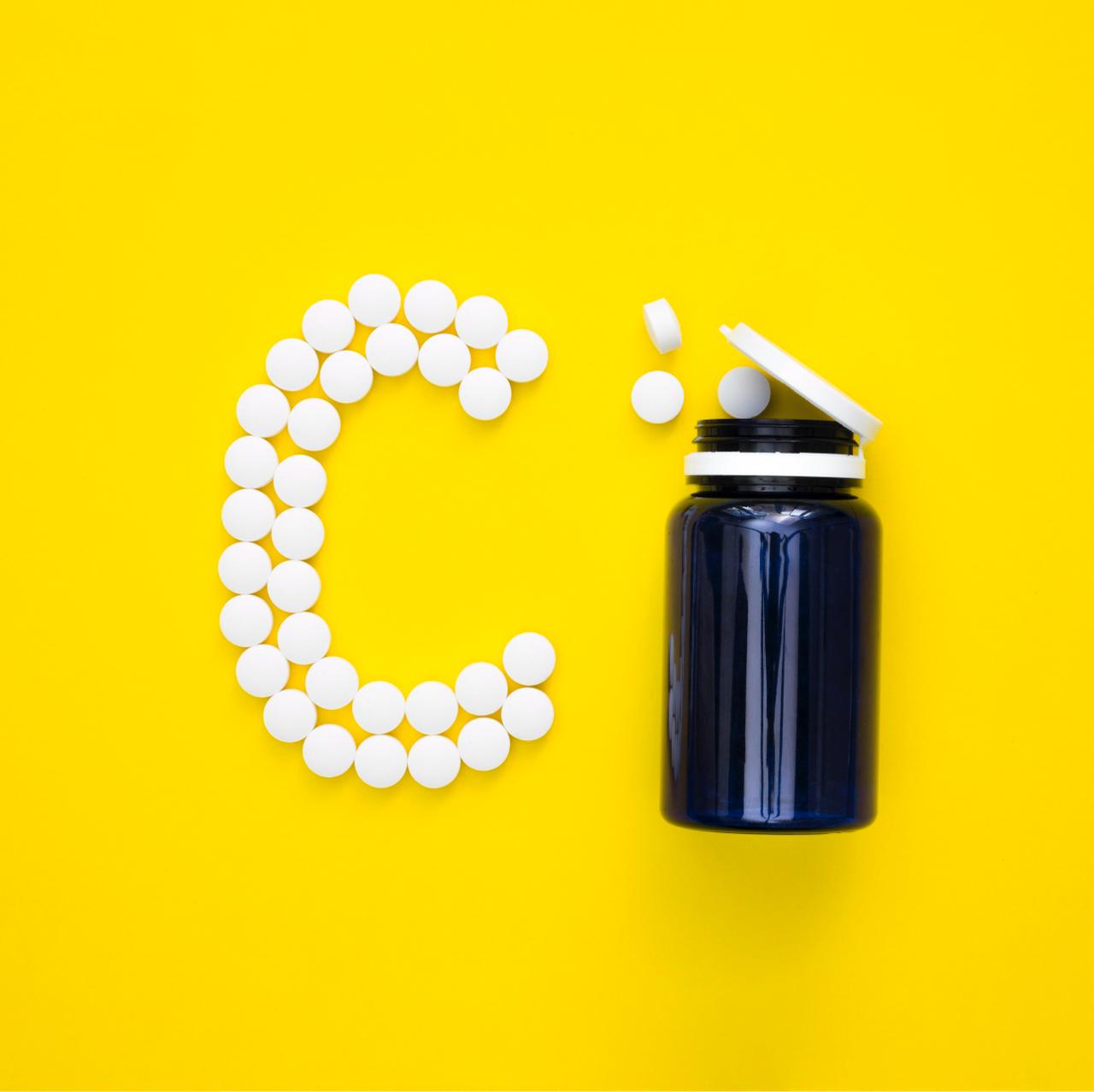 Top view plastic container pills spelling letter